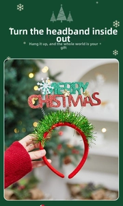 Detail of red Christmas headband with glittery Merry Christmas text and gold stars