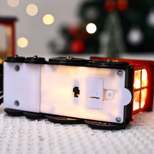 Detailed bottom view of the Christmas train night light showing battery compartment and power switch