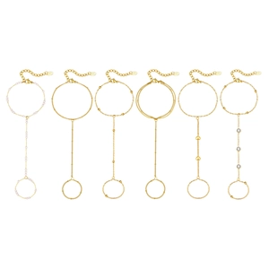 Set of six gold stainless steel slave bracelets with pearls, hearts and zircons