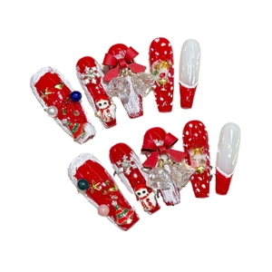 Handmade Christmas press-on nails with 3D Santa, pearls and red bows on long coffin shape