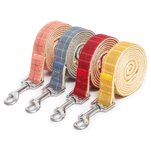 Adjustable plaid dog harness set with metal buckles in pink, blue, red, and yellow colors