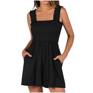 Detail view of black smocked jumpsuit featuring a square neck and sleeveless design