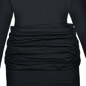 Detail shot of black bodycon dress featuring elegant side ruching and elastic fabric texture