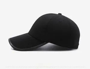 Side view of black baseball cap showing six-panel stitching and leather-edged brim