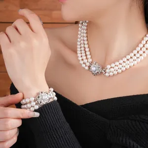 Three-layer pearl jewelry set with a floral rhinestone clasp for an elegant vintage look