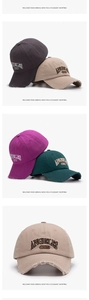 Close-up of Angeles 1994 embroidery on vintage washed cotton baseball cap with frayed brim