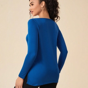 Slim fit navy blue long sleeve yoga top with side slits and knitted texture
