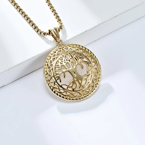 Vintage Tree of Life pendant necklace with Celtic knot patterns on a white podium