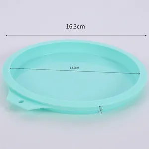 Detail view of 16.3cm mint green silicone cake mold with dimension markings and hanging hole