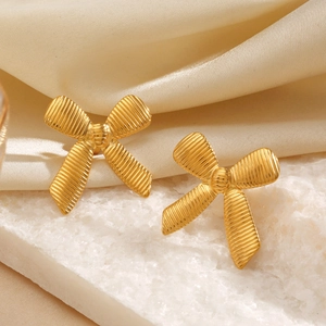 Chic 18K gold plated bow earrings with striped texture on white stone and beige silk