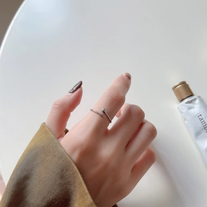 Minimalist 925 sterling silver water drop ring shown on hand with high polish finish