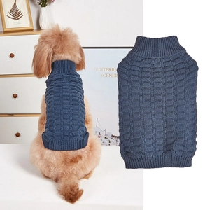 Detailed view of dark blue pet knit sweater featuring classic checkered texture and turtleneck