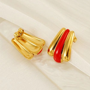 Vintage 18k gold plated fan earrings with red enamel stripes on ivory fabric