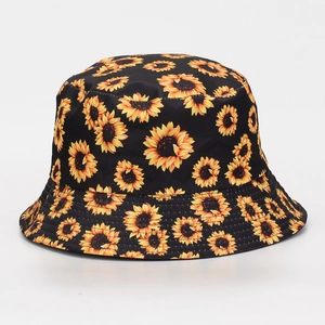 Front view of a black outdoor bucket hat with vibrant sunflower print pattern