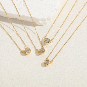 Set of four minimalist gold chain necklaces with zircon geometric pendant charms