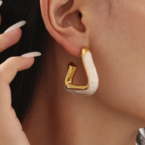 Modern geometric hollow triangle gold plated earrings with white enamel inlay for women