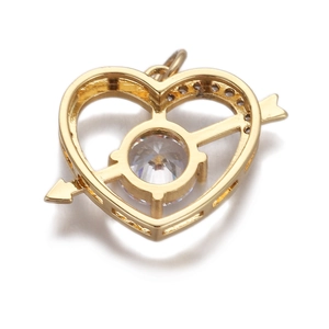 Macro shot of gold heart-shaped arrow pendant with clear round zircon stones