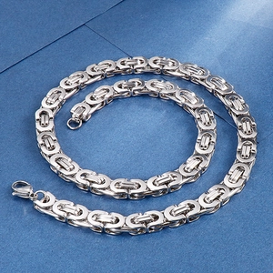 Close-up of silver stainless steel Byzantine chain necklace with lobster clasp closure