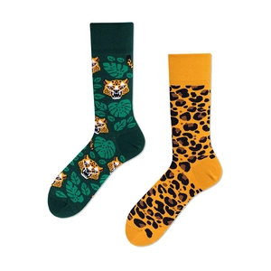 Flat lay detail of cotton socks featuring a tiger, palm leaves, and leopard print pattern