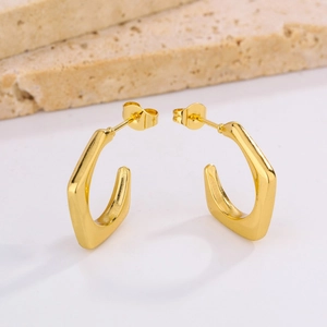Minimalist 18K gold plated stainless steel oval hoop earrings on decorative stone