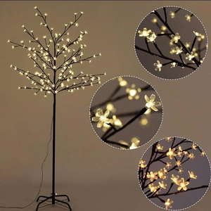 Detail view of cherry blossom LED tree light showing stable base and warm petals