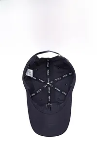 Detailed interior of a 100% cotton baseball cap showing branded lining and wash label