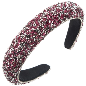 Macro detail of thick padded headband featuring dense pink and silver rhinestone patterns