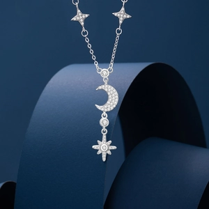 Elegant 925 sterling silver star and moon necklace with shimmering zircon stones