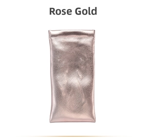 Detail view of rose gold PU leather sunglass pouch with textured finish and squeeze closure