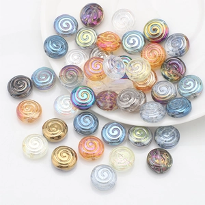 Detail shot of multi-colored spiral glass beads with polished luster for DIY jewelry