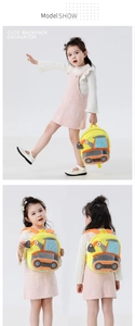 Detail view of yellow plush excavator backpack for kids showing soft texture and straps