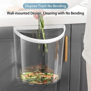 Wall-mounted clear kitchen compost bin with white frame for easy waste disposal
