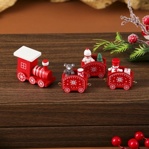 Detailed view of handcrafted wooden Christmas train set with festive bear and snowman figures