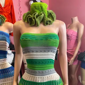 Macro detail of handmade crochet knit bikini top with green stripes and diamond openwork