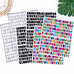 Detail of waterproof A-Z alphabet stickers in black, silver, and rainbow holographic colors