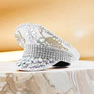 Close-up of luxury captain hat featuring silver sequins and sparkling rhinestones