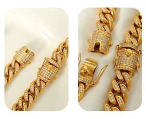 Detail of the gold-plated Cuban chain with a diamond-set clasp and secure closure mechanism