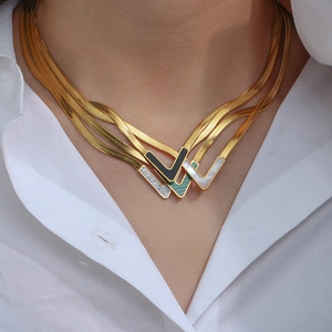 Layered 18K gold stainless steel snake chain with V-shaped natural shell pendants
