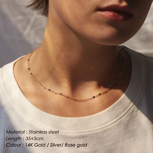Minimalist stainless steel chain necklace in 14K gold finish with adjustable clasp