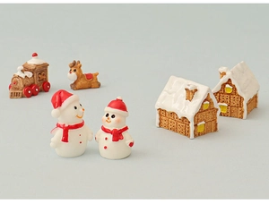 Miniature Christmas set with snowmen, gingerbread houses, reindeer, and a small train