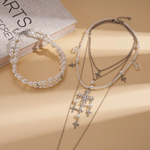 Elegant two-piece multi-layer pearl necklace and bracelet set with diamond cross pendant