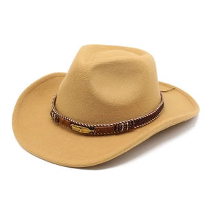 Detailed shot of ethnic braided band and gold feather pin on khaki wool cowboy hat