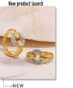 Detail view of two 18k gold plated titanium rings with sparkling pavé cubic zirconia