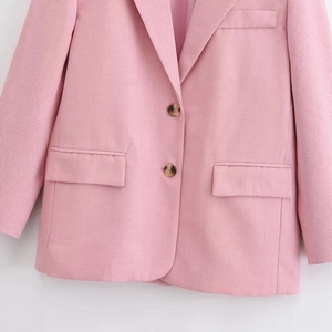 Chic light pink blazer with tortoiseshell buttons in a professional flat lay style