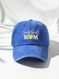 Close-up of Softball MOM embroidery with heart-shaped softball on washed navy cap
