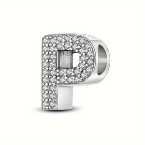 Macro shot of silver letter P charm bead with sparkling cubic zirconia pavé stones