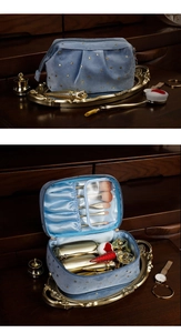 Detail view of blue velvet makeup bag with gold stars, inner brush slots and silk lining