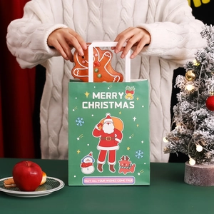 Christmas gift bag featuring Santa Claus illustration and white handles for holiday treats