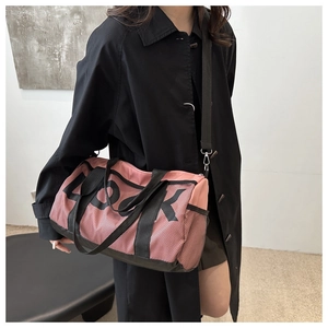 Detail showing pink mesh fitness bag with 'LOOK' text and adjustable black shoulder straps