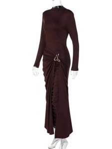Detailed view of dark brown elegant dress with side gathers and gold metal buckle detail